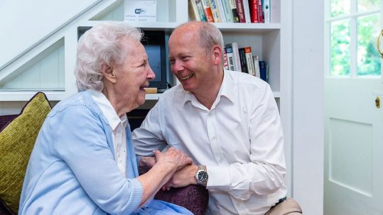Time to consider a care home. David Tanner with a resident.